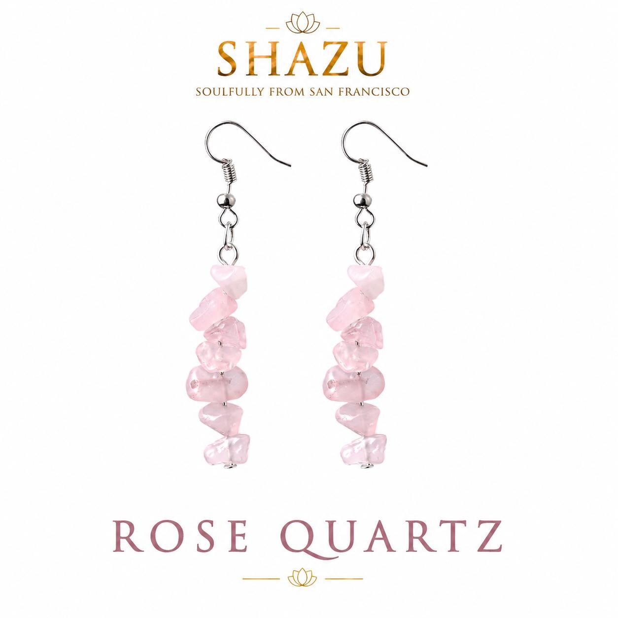 May include: Dangle earrings featuring irregular, tumbled light pink rose quartz chips strung on silver-toned metal hooks. The text SHAZU SOULFULLY FROM SAN FRANCISCO and ROSE QUARTZ appears above and below the earrings on a white background.