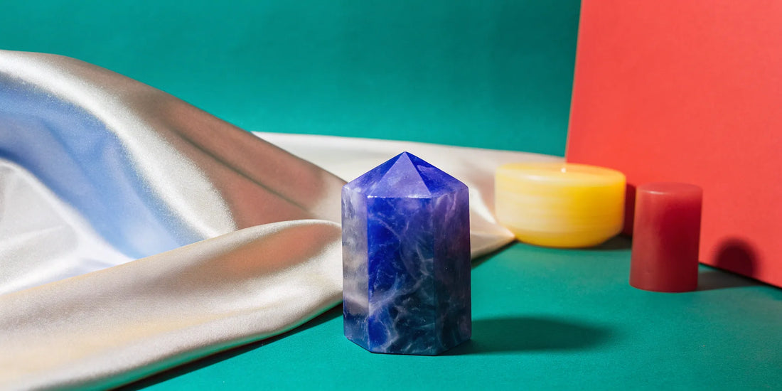 Amethyst stone on green surface.