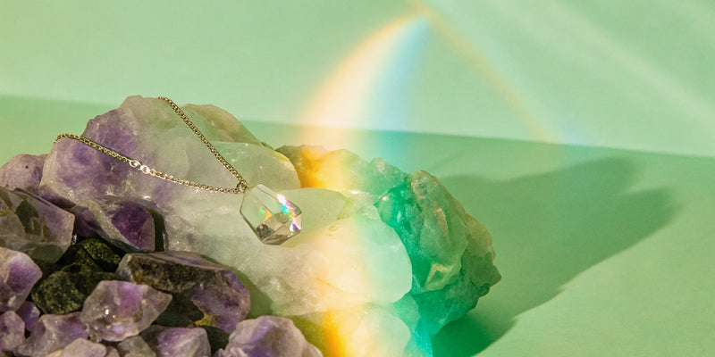 Clear quartz necklace amplifying energy and promoting clarity.