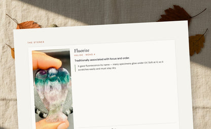 A stone card page showing mineral family, hardness, what causes the colour, and care