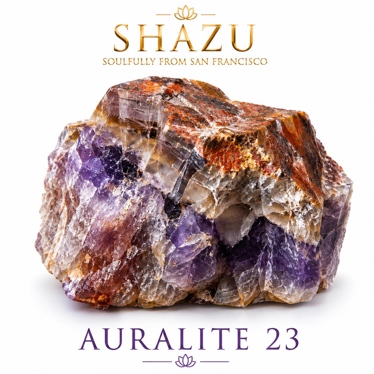 May include: A raw Auralite 23 crystal specimen featuring a mix of deep purple, translucent white, and rusty orange-brown mineral inclusions. The text SHAZU SOULFULLY FROM SAN FRANCISCO appears above the stone, and AURALITE 23 is printed below.
