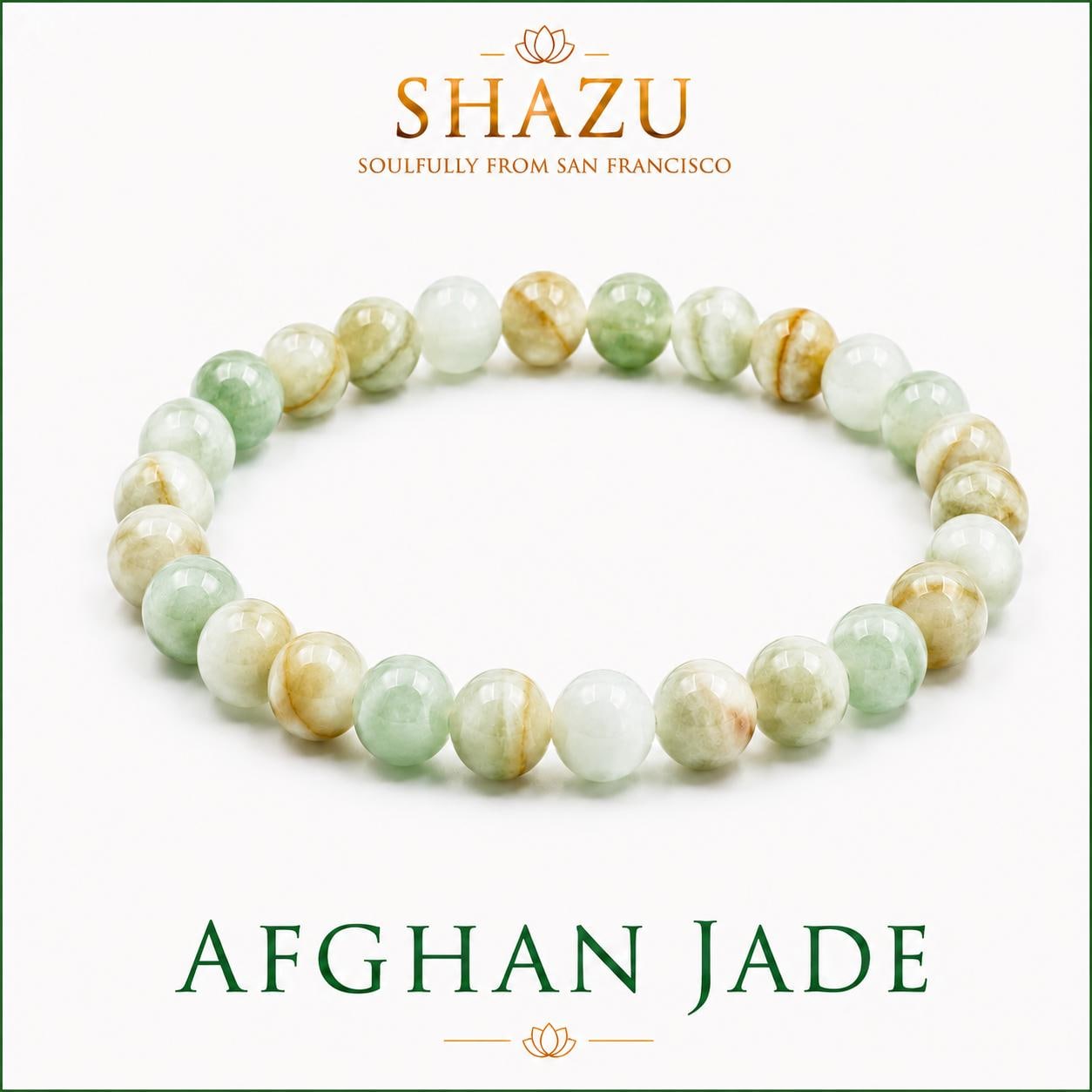 May include: A beaded bracelet made of smooth, round Afghan jade stones in varying shades of translucent pale green, white, and light brown. The text SHAZU SOULFULLY FROM SAN FRANCISCO and AFGHAN JADE is printed in dark green and gold lettering.