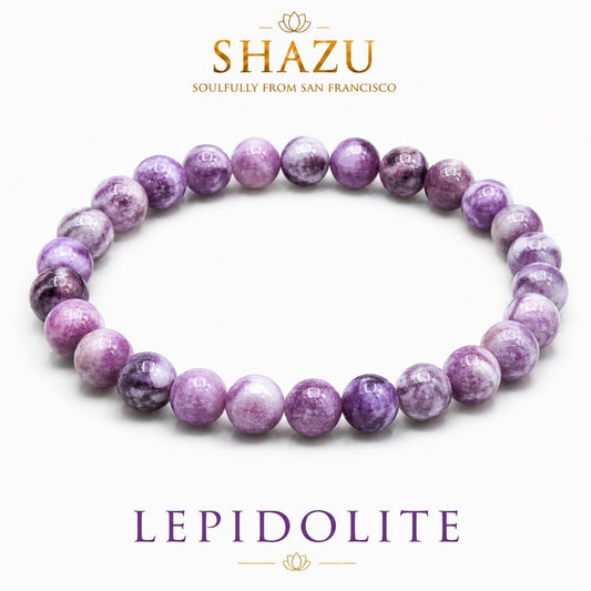 May include: A circular beaded bracelet composed of smooth, round, variegated purple and white lepidolite stones. The image includes the text SHAZU SOULFULLY FROM SAN FRANCISCO at the top and the word LEPIDOLITE in purple text at the bottom.