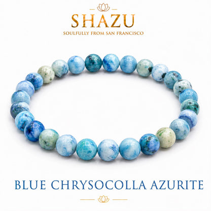 May include: A beaded bracelet made of round blue chrysocolla azurite stones with marbled patterns in shades of light blue, teal, and white. The text SHAZU SOULFULLY FROM SAN FRANCISCO and BLUE CHRYSOCOLLA AZURITE is printed above and below the bracelet.