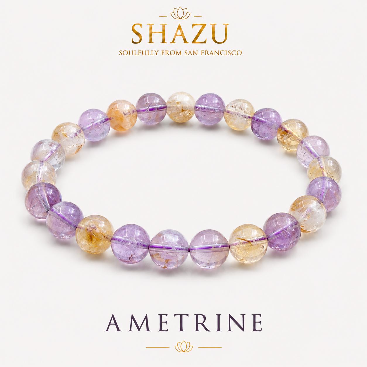 May include: A beaded bracelet featuring alternating round, polished ametrine stones in shades of translucent purple and golden yellow. The text SHAZU SOULFULLY FROM SAN FRANCISCO and AMETRINE appears above and below the jewelry piece.